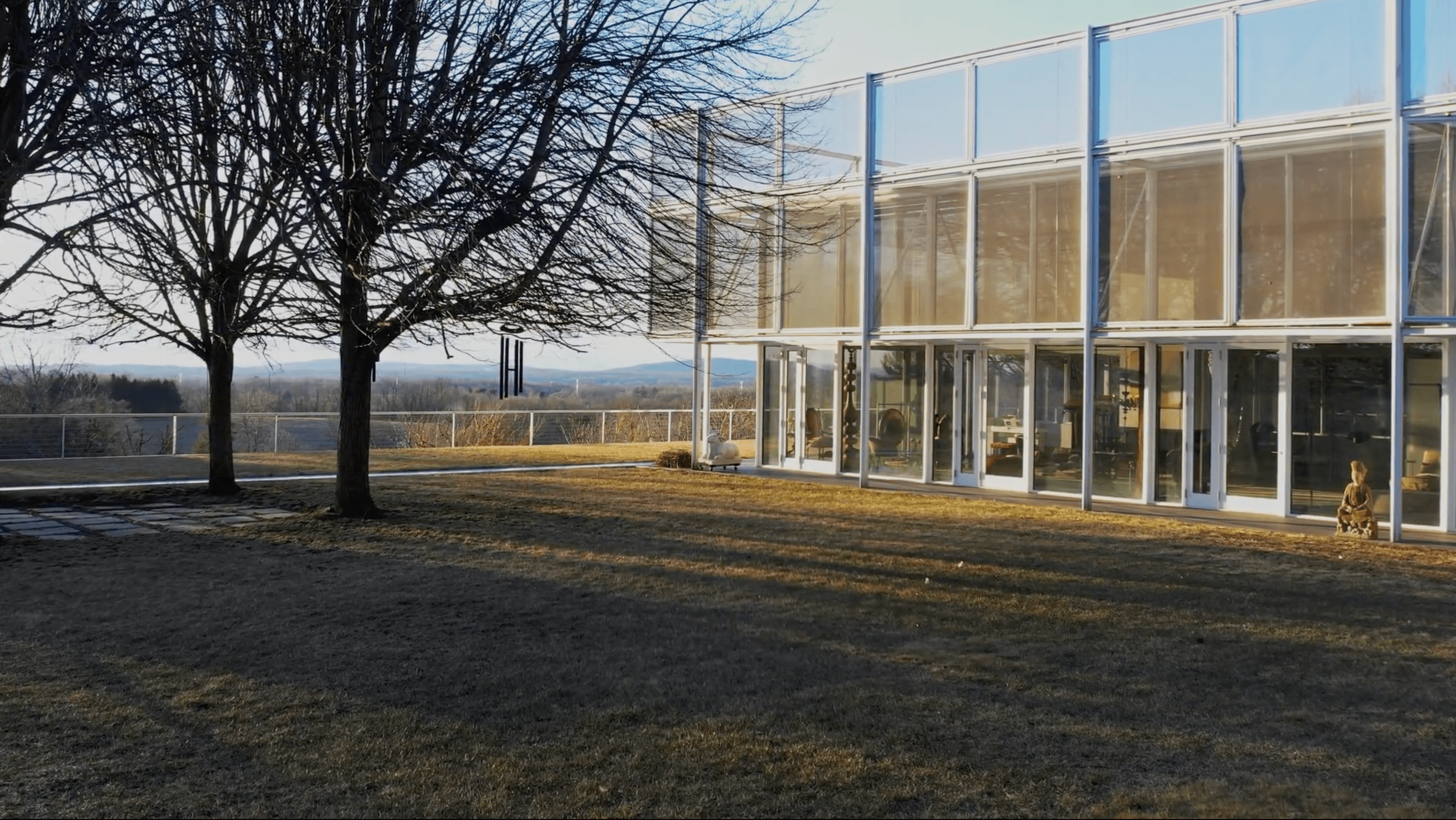 Bedroom with large windows and mountain view